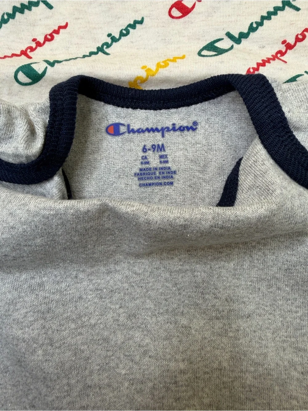 Champion 4-piece baby bodysuit bundle in size 6-9 months/9 months